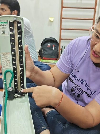 A physiotherapy student in our DNYS course learns to use a sphygmomanometer. Our curriculum is designed to be practical and thorough.