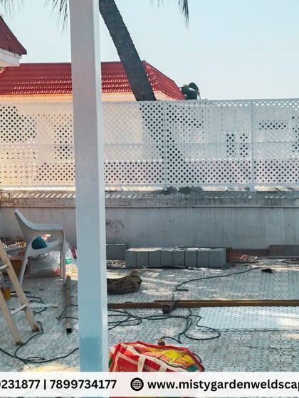 During the installation of a terrace makeover, a PVC lattice screen is added for privacy. This material is durable, weather-resistant, and adds a clean, modern aesthetic.
