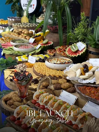 We had a great time creating this impressive grazing table for a JBL product launch. The menu was designed to be energetic and modern, featuring items like mini tacos, sliders, and fresh tarts to match the brand's vibrant identity.