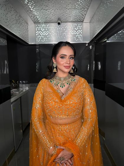 The complete look of our Roka bride, from her elegant hairstyle to her stunning jewellery.