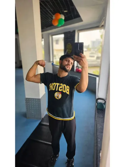 Flexing the results of consistent training. Every workout, every rep, every drop of sweat contributes to the final result.