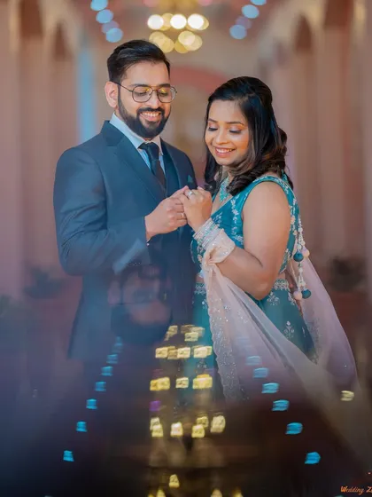 A dreamy portrait of Saili and Jayant, captured through a crystal or prism to create a beautiful, artistic foreground blur. This technique adds a touch of magic to the photo.