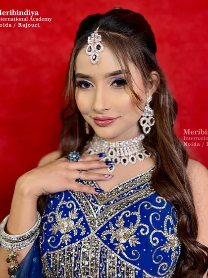 Our engagement makeup training teaches you to create looks that are both glamorous and radiant, like this stunning look with bold blue eyeshadow and sparkling jewelry.