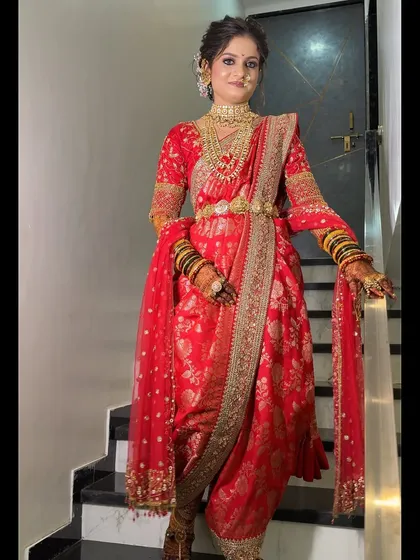 The complete look of the bride in her red Nauvari, ready for her wedding day.