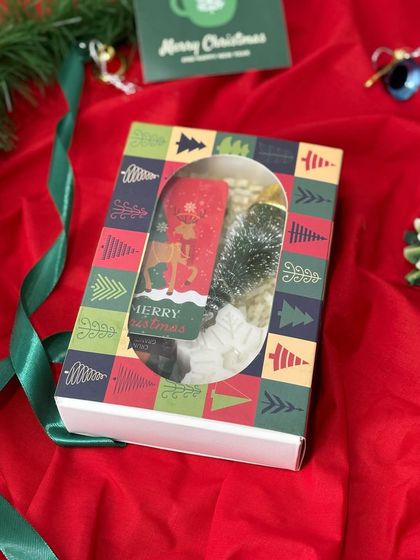 This beautifully packaged Christmas gift box with a window display is perfect for showcasing the festive goodies inside. It's a great start to the holiday gifting season.