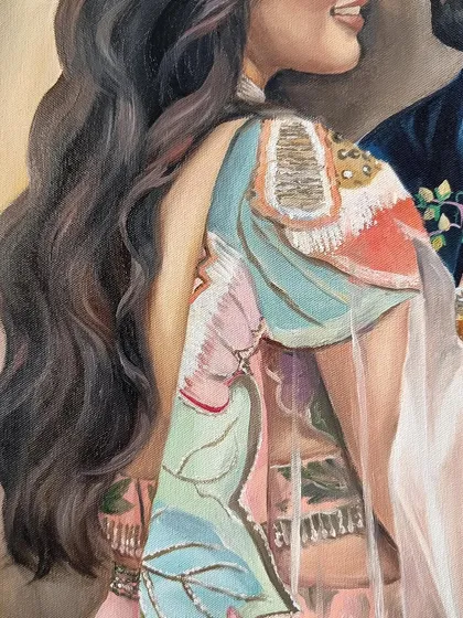 A close-up on the bride's unique, multi-colored outfit and the flow of her hair.