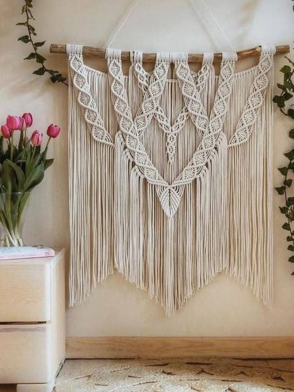 This elegant wall hanging features a heart-like central pattern and is perfect for adding a touch of romance and boho charm. It looks beautiful styled with fresh flowers.