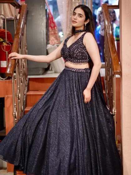 Walk into the spotlight in this shimmering navy lehenga like you own it. The sparkle is unreal.