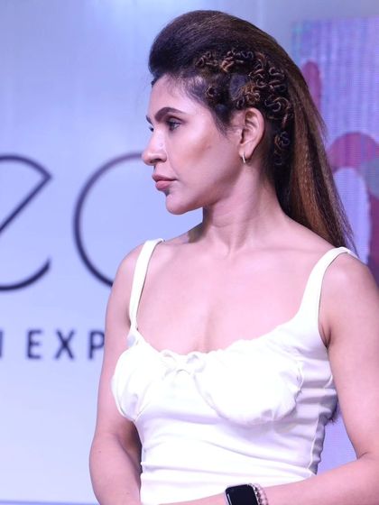 A side view of the creative crimped hairstyle, showcasing the blend of different textures.