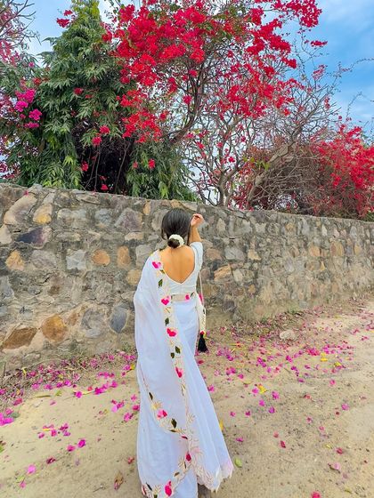 Another view of the back, with my hand adjusting the gajra in my hair. It's these little details that make a look feel complete and authentic.