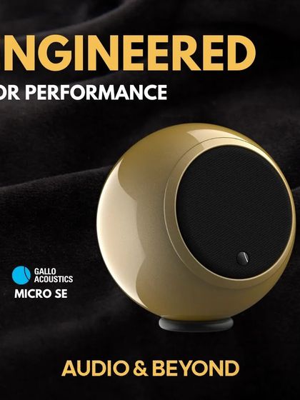 The Gallo Acoustics Micro SE speaker is engineered for performance. This image showcases its compact, spherical design in a luxurious gold finish, perfect for placement on a console or table to deliver high-quality sound from a small source.