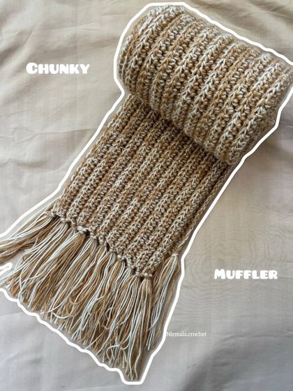 This chunky muffler is two meters long, perfect for wrapping up in on a cold day. The fringe is made from the same soft, textured yarn.