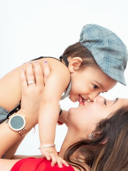 A sweet moment between a mother and her baby. We focus on capturing the love and connection in every family portrait.