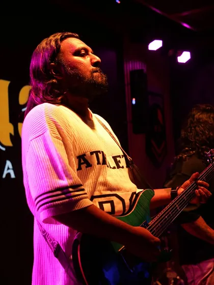 Strings of magic, chords of fire. Our guitarist, crafting the melodies and riffs that define our Bollywood rock sound.