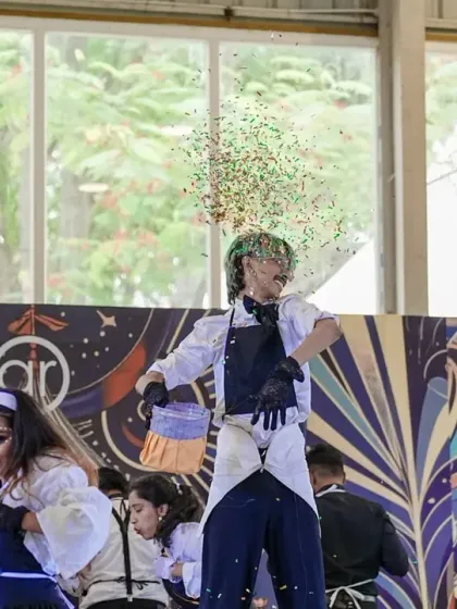 A dancer showers the stage with confetti, a magical moment from the runner-up's theatrical performance.