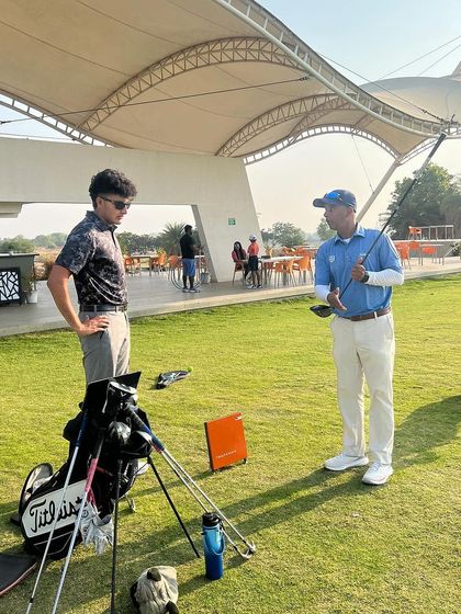 A one-on-one session on the driving range. I take ownership of my players' journeys, but their commitment to the work I give them shows me how hungry they are.