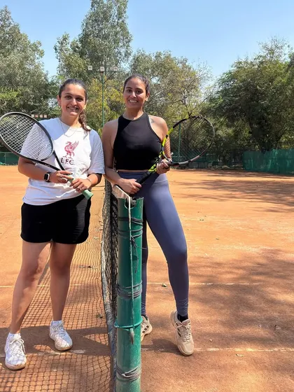 Two players from our adult program enjoying the atmosphere at our Amateur Tournament. It's a great way to meet fellow tennis enthusiasts and test your skills.