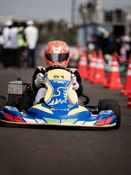 A front-facing shot of our driver in the number 81 kart, heading into a coned section.