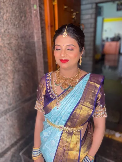 A serene moment captured. The soft, shimmering eyeshadow and perfectly blended base gave her a divine look for this important day.