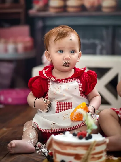 A close-up of one of the little bakers, with evidence of a delicious cake smash! These messy moments make for the most memorable photos.