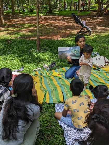 Photos from our 'Environment' week session. You can see the children learning about nature and conservation through engaging stories, right in the heart of nature itself.