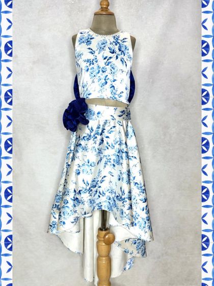 The front view of our blue floral brunch set. The clean lines of the crop top balance the full, high-low skirt, creating a chic and modern look.
