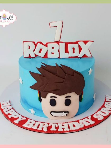 A cool Roblox-themed cake for a 7th birthday. This design features a popular character face from the game, making it a trendy and exciting choice for a young gamer.