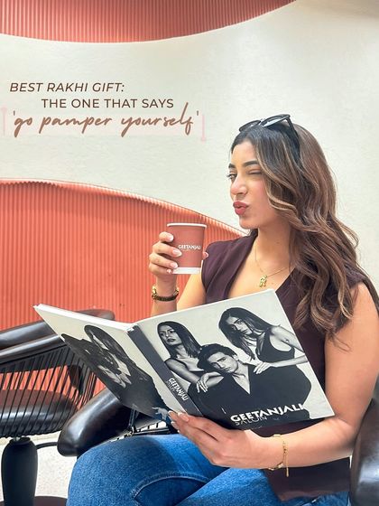 The best Rakhi gift is one that says 'go pamper yourself'. A client enjoys her gift card from her brother, relaxing with a coffee and planning her new look.