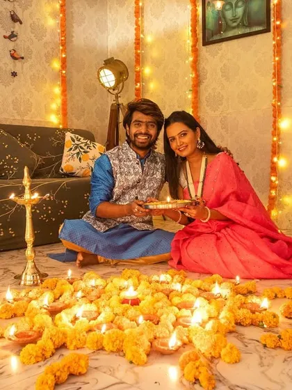 Bringing the Diwali magic into the studio. I love creating these warm, festive setups with marigolds and diyas for a truly special Shubh Dipavali couple session.