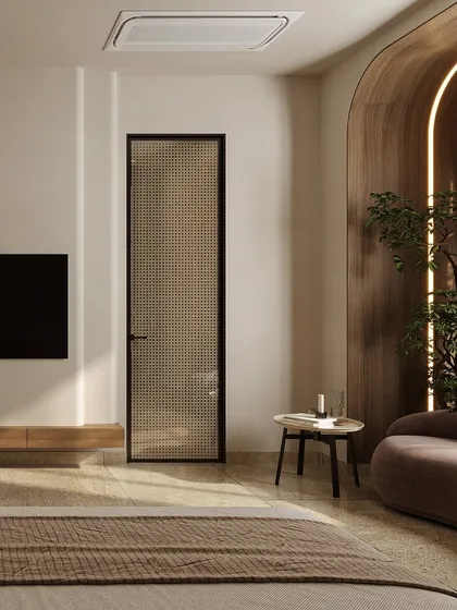 This shot highlights the material palette, including a perforated glass door and a curved wood wall feature. These elements add layers of texture and light, contributing to the room's serene and tactile quality.