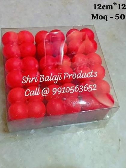 A 12cm square PVC box filled with red bubble candles. This is a great way to package a set of 9 candles for gifting.