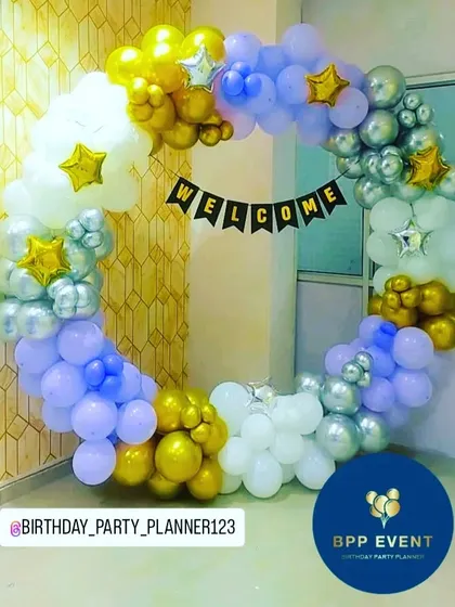 A 'Welcome' ring decoration in a beautiful color combination of purple, blue, white, and gold.