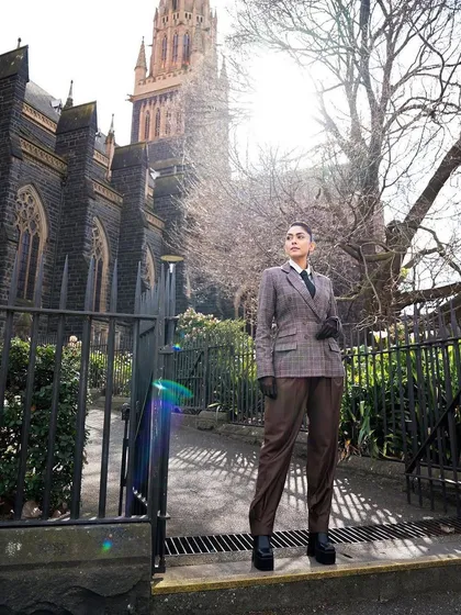 Another full-length shot of the custom plaid suit, a truly unique piece available for rent.