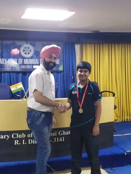 Ansh Karnavar receiving his winner's medal at the Rotary Club tournament in Ghatkopar.
