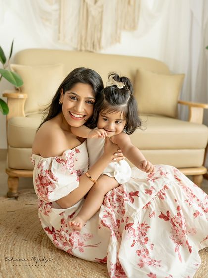 A mother and daughter portrait, full of smiles and love.