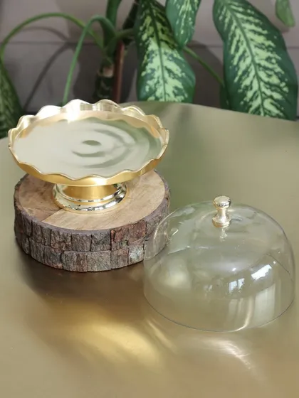 The Gold Scallop Dessert Stand with its glass cloche removed, showcasing the beautiful scalloped gold base. It’s a versatile piece that’s stunning with or without the dome.