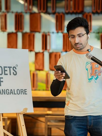 A poet reads his work, contributing to the rich tapestry of stories about the different seasons of life.
