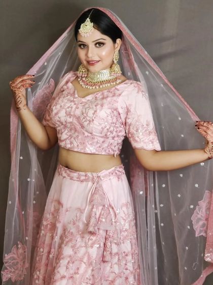 A lovely pastel pink lehenga with delicate embroidery. This is a perfect choice for an engagement, sangeet, or for the modern bride who loves soft colors.