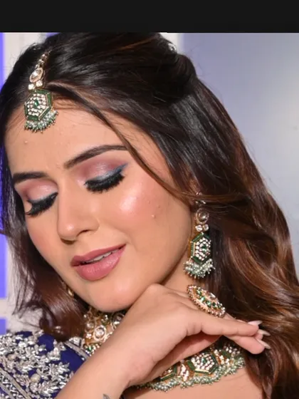 A soft and glamorous shot showcasing the blended eyeshadow and flawless base. This look is perfect for a bride who wants to make a statement at her sangeet.