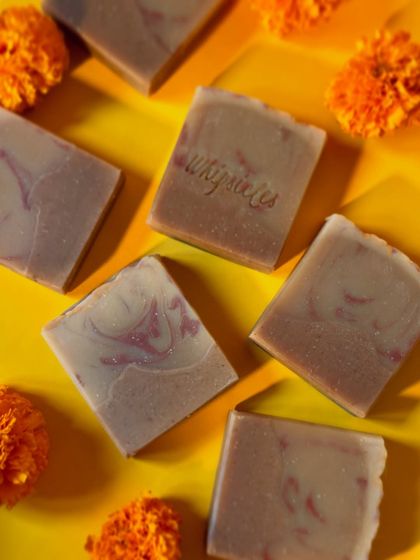 A beautiful arrangement of our Zaffran Utsav soaps with marigold flowers, capturing the essence of Diwali.