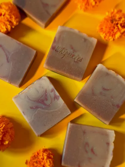 A beautiful arrangement of our Zaffran Utsav soaps with marigold flowers, capturing the essence of Diwali.