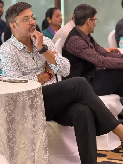 Listening intently to the discussion at the conclave. Understanding sports psychology is crucial for holistic athlete development.