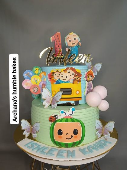 A closer look at Ishleen's two-tier Cocomelon birthday cake with the iconic yellow school bus.