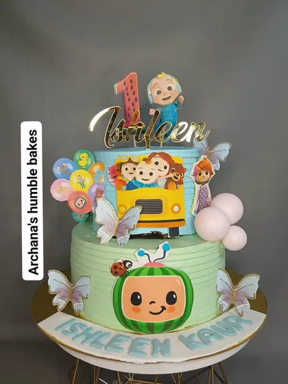 A closer look at Ishleen's two-tier Cocomelon birthday cake with the iconic yellow school bus.