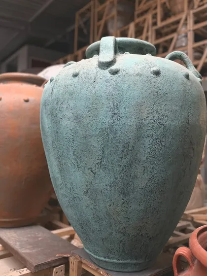 The classic 'Gentong' planter is now available in a beautiful new teal hue with a distressed finish.