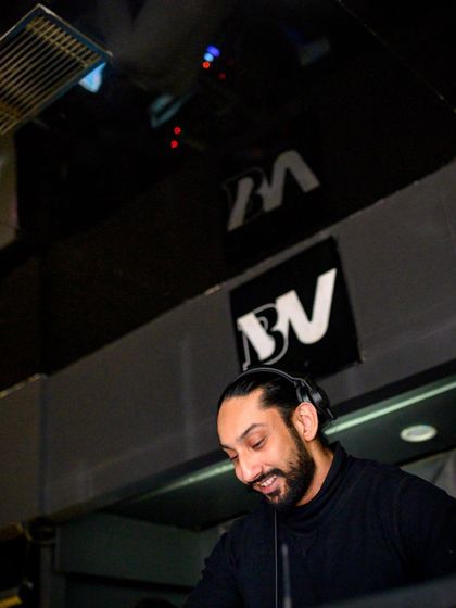 A candid shot of me smiling during a set. I genuinely love what I do, and that passion translates into my performance.