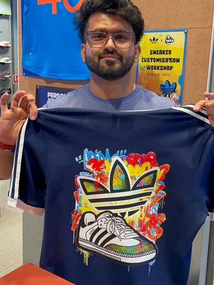 This customer chose a vibrant, graffiti-style sneaker design for his custom t-shirt. We offer a wide range of our original artwork for live printing.
