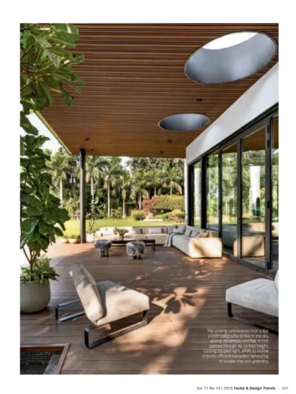 This view shows how the outdoor lounge area is designed for relaxation and conversation. The furniture is low-profile and comfortable, ensuring that the focus remains on the expansive garden views.