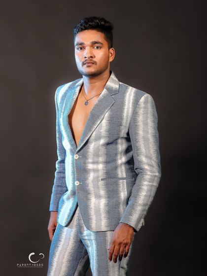 A strong and simple standing portrait. The direct gaze and clean composition make this a timeless and effective shot for a model's portfolio.