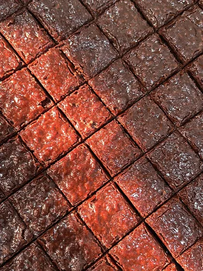 A satisfying grid of our signature fudgy brownies. Each bite-sized square is rich, gooey, and completely free from refined sugar and eggs, making it a perfect guilt-free indulgence.
